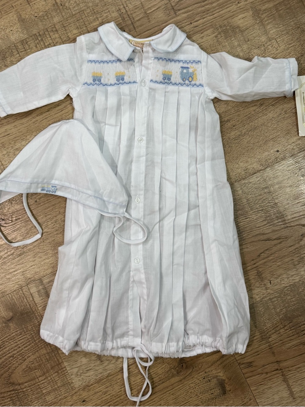 Carriage Boutique White Smocked Gown with Blue and Yellow Train Embroidery